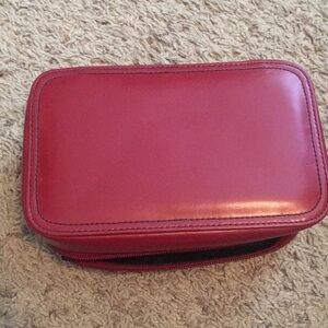 Lancôme cosmetic red case with zipper closure